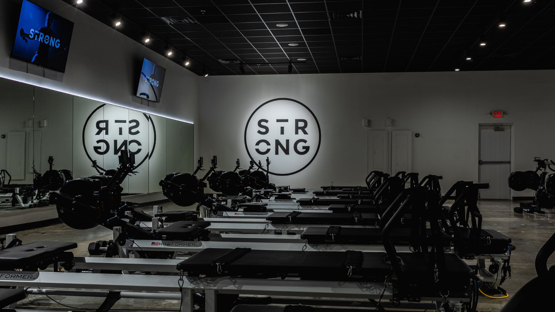 STRONG Pilates studio with rows of Rowformers and the STRONG logo